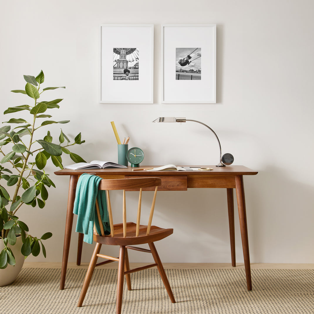 Two white frame with black and white photos