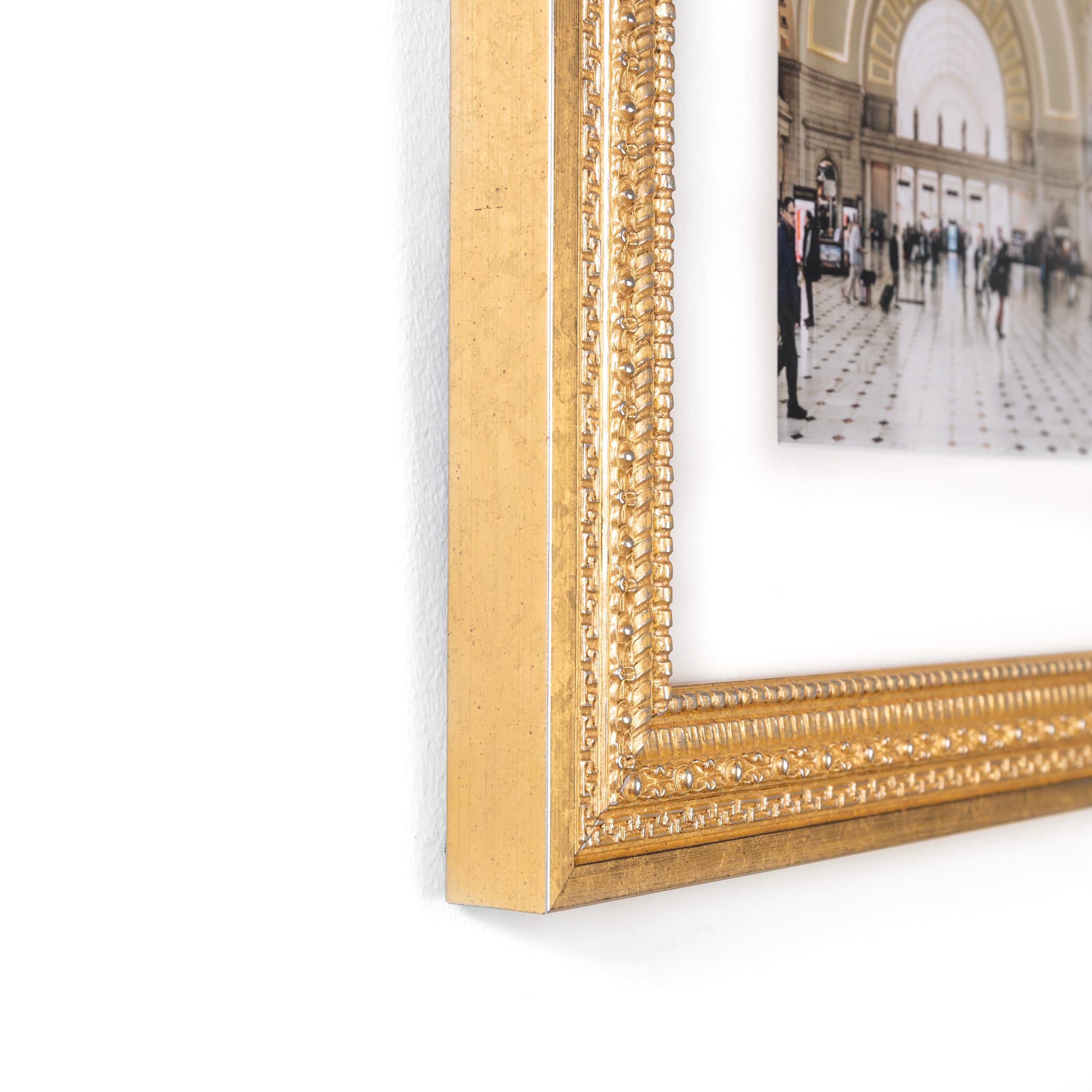 bottom left corner of Photo of Union Station in ornate gold Marquette frame with a white mat