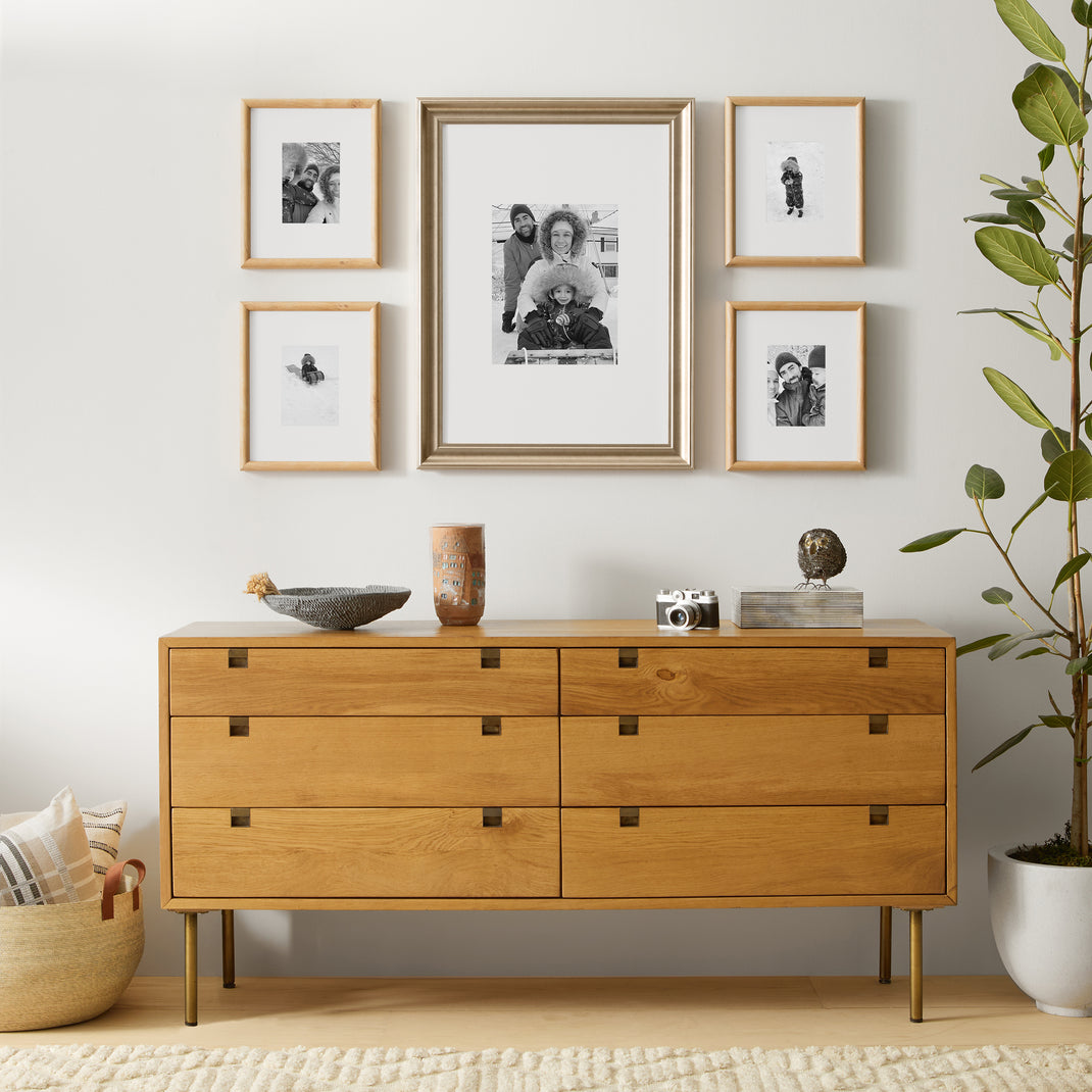 5 frames with black and white family photos