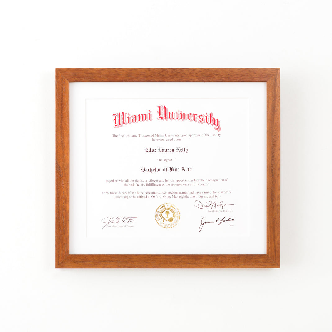 Miami university diploma framed in warm natural wood Sonoma frame