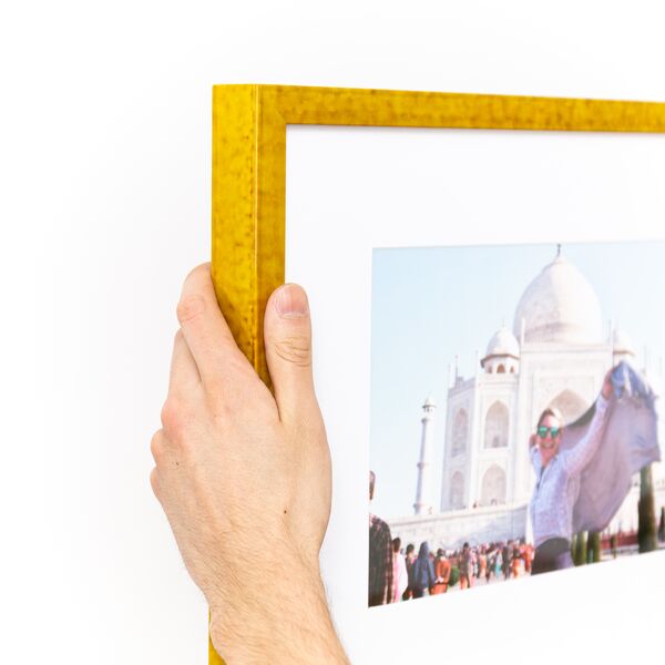 top left corner of a travel photo framed in mustard yellow glazed Agra frame