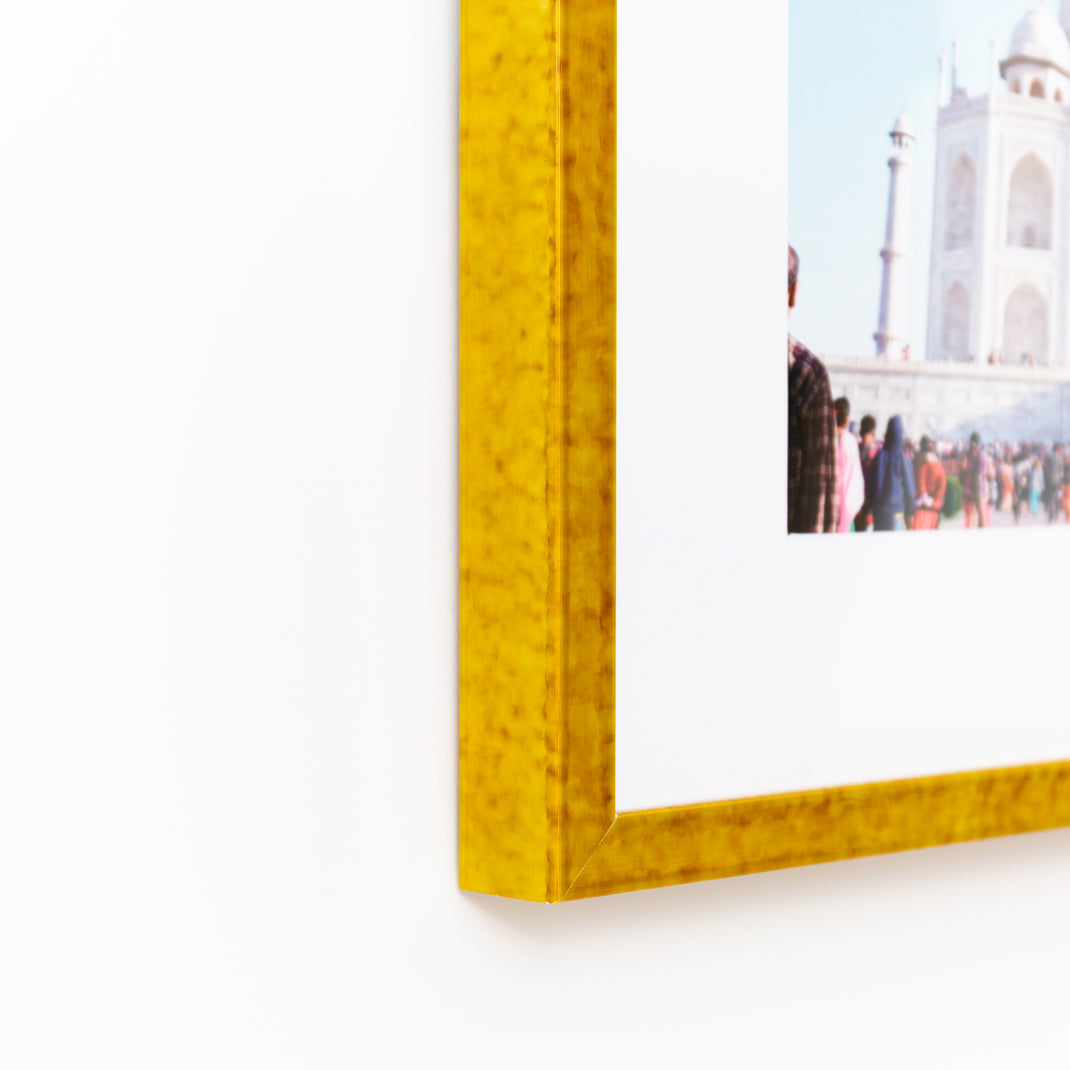 bottom left corner of a travel photo framed in mustard yellow glazed Agra frame