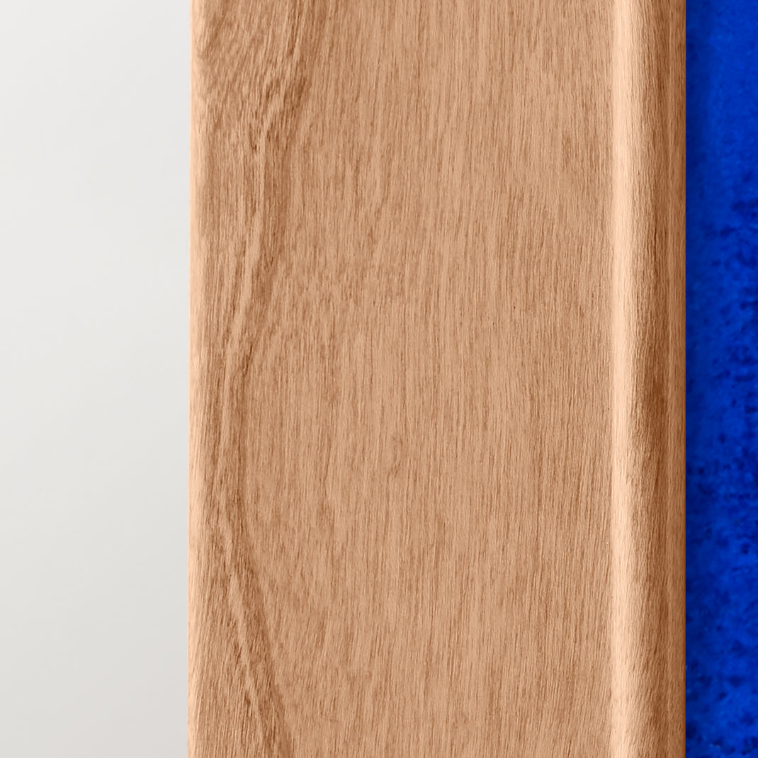 Closeup of a colorful blue abstract painting in a cherry angled hardwood frame