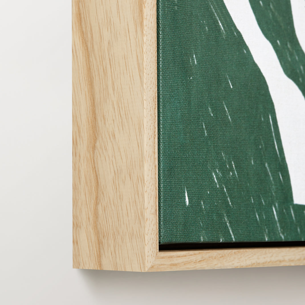 Left corner of colorful botanical canvas painting in a ash hardwood floater frame