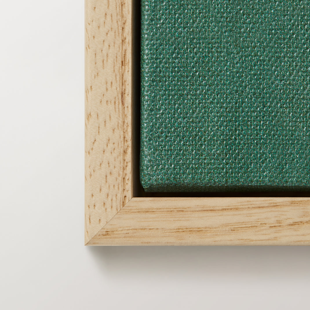 Right corner of colorful botanical canvas painting in a ash hardwood floater frame