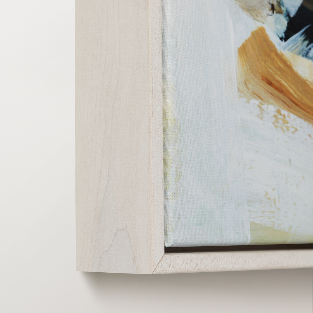 Bottom right corner of colorful abstract canvas painting in a bleached maple floater frame