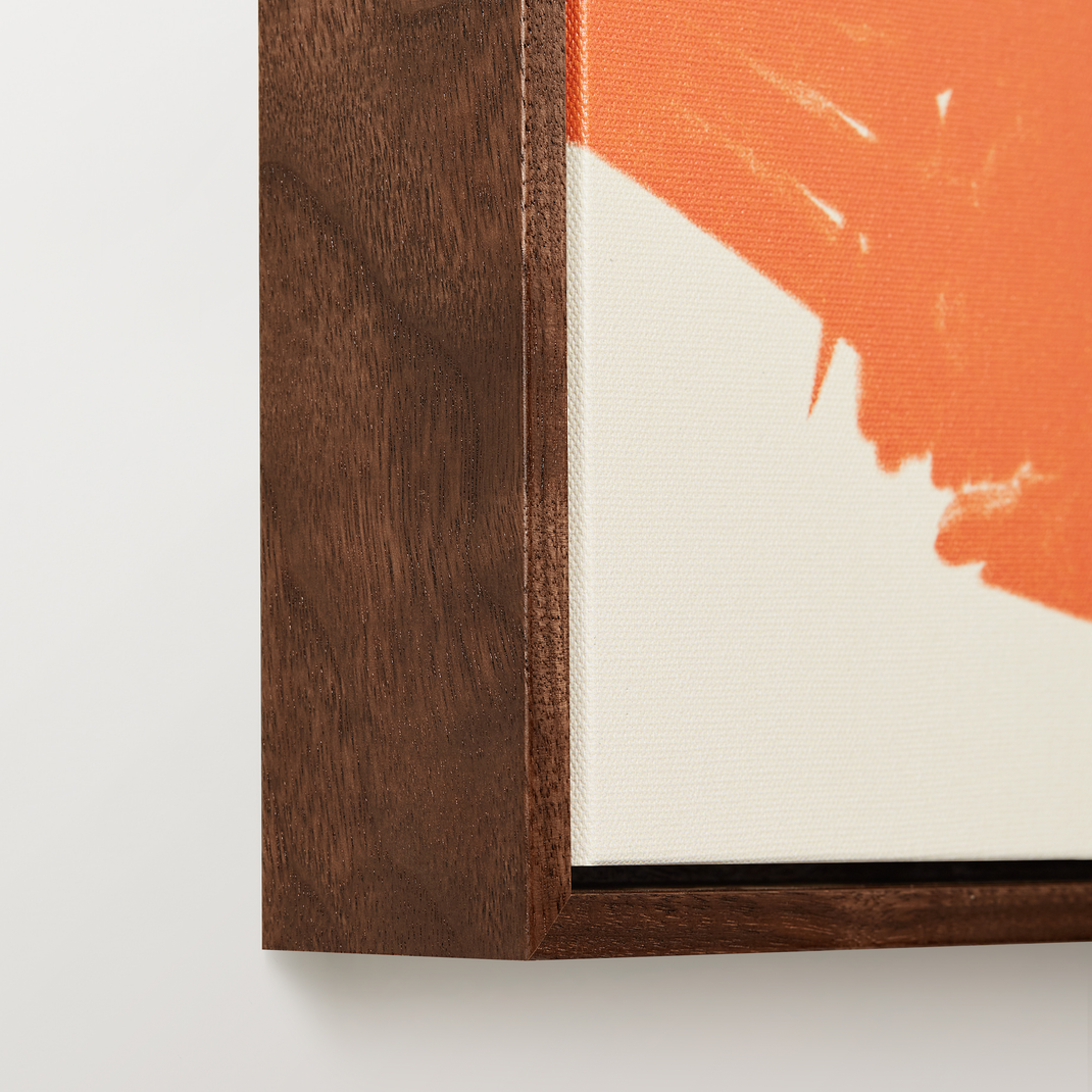 Bottom left corner of colorful canvas painting of a stylish woman in walnut floater frame