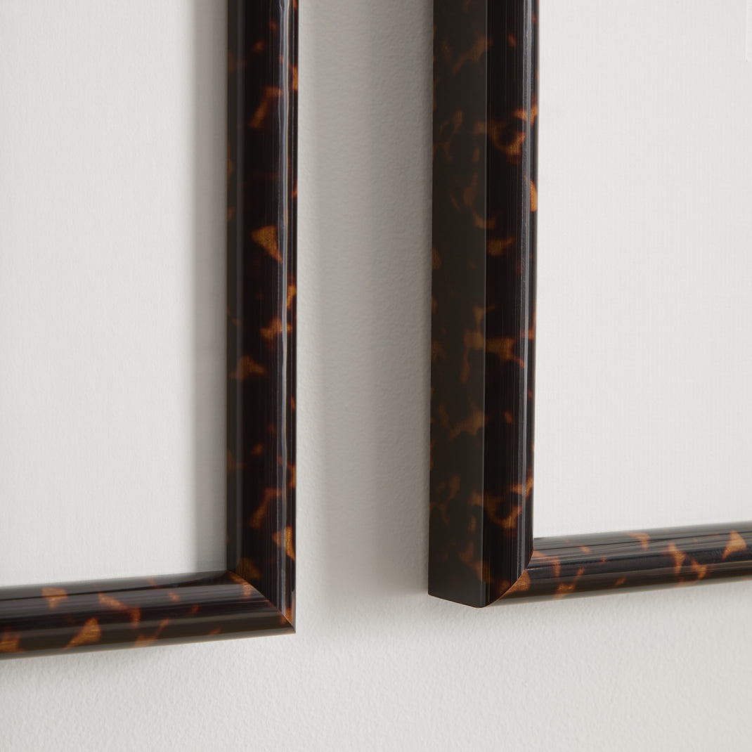 Two tortoiseshell frame with black and white photos