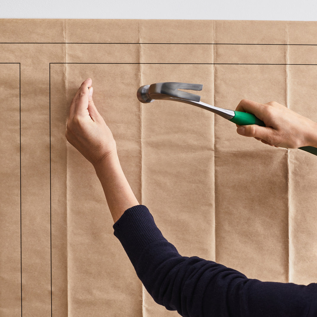 Hammer going into nail