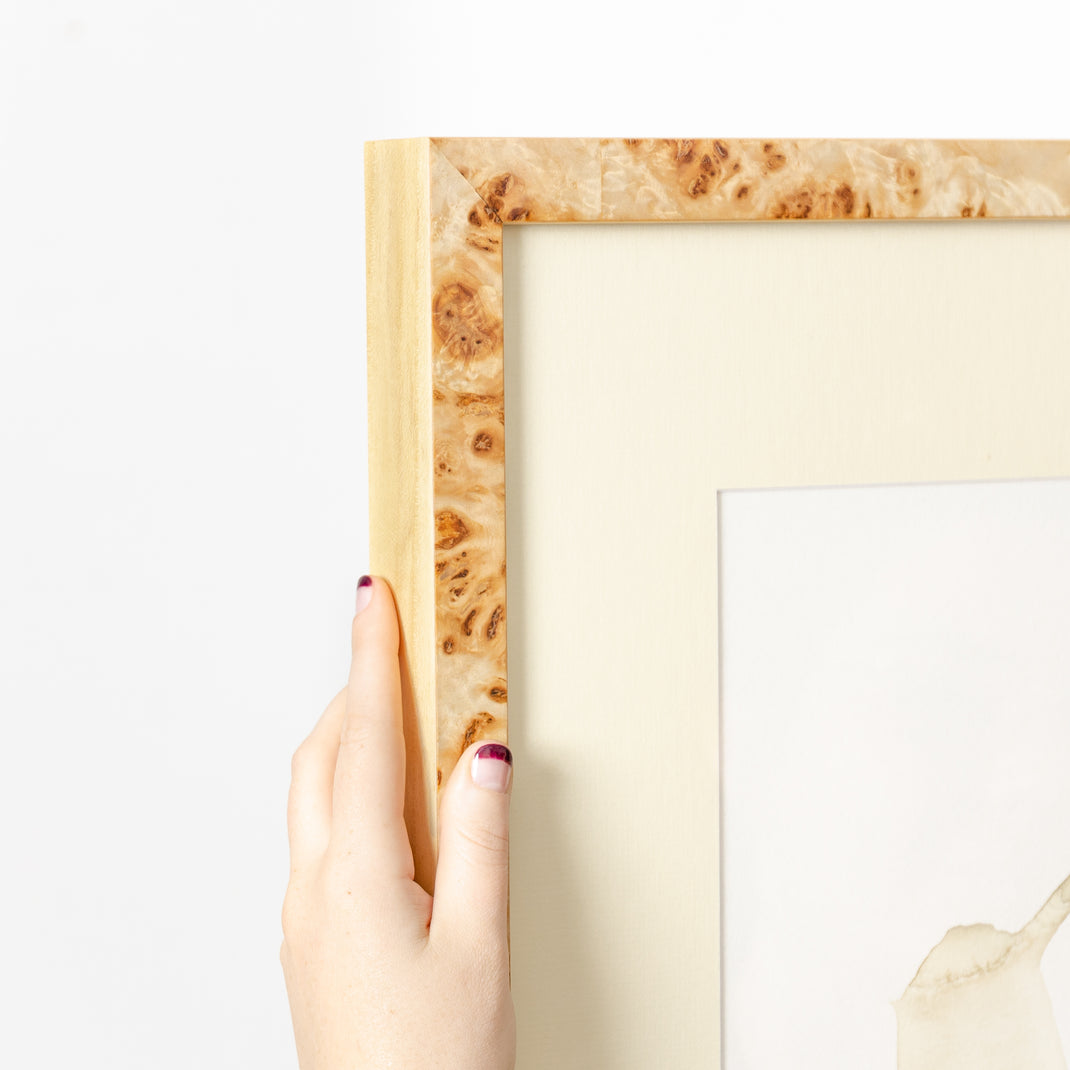 top left corner of vintage handwritten letter framed in gallery burl wood Giza frame with a white mat