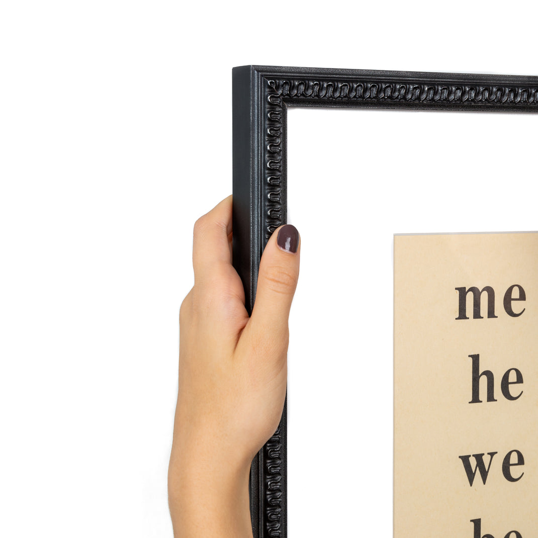top left corner of pages of a sight words book framed in wavy matte black Gresham frame with white mat