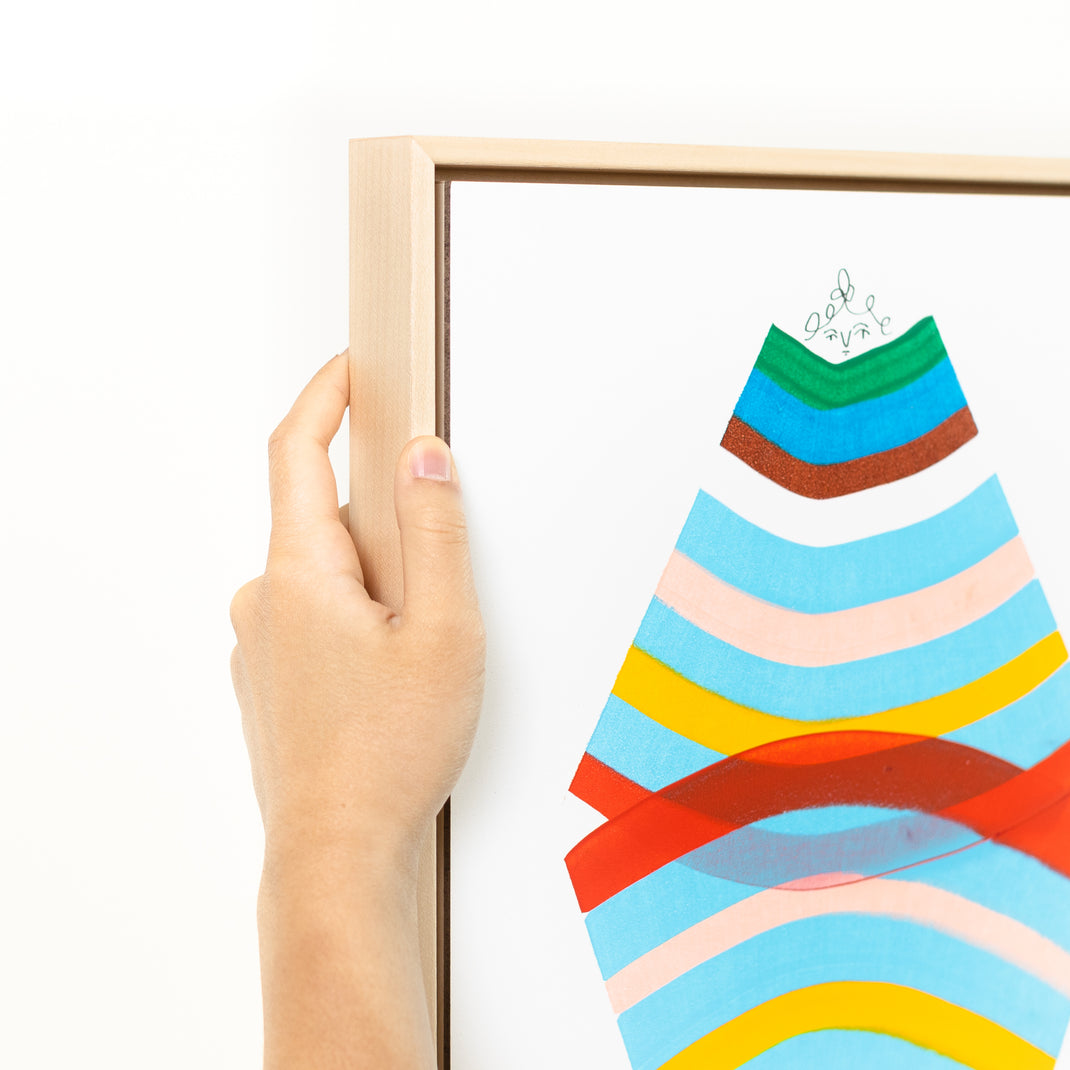 top left corner of abstract rainbow portrait framed in Laguna natural wood canvas floater frame
