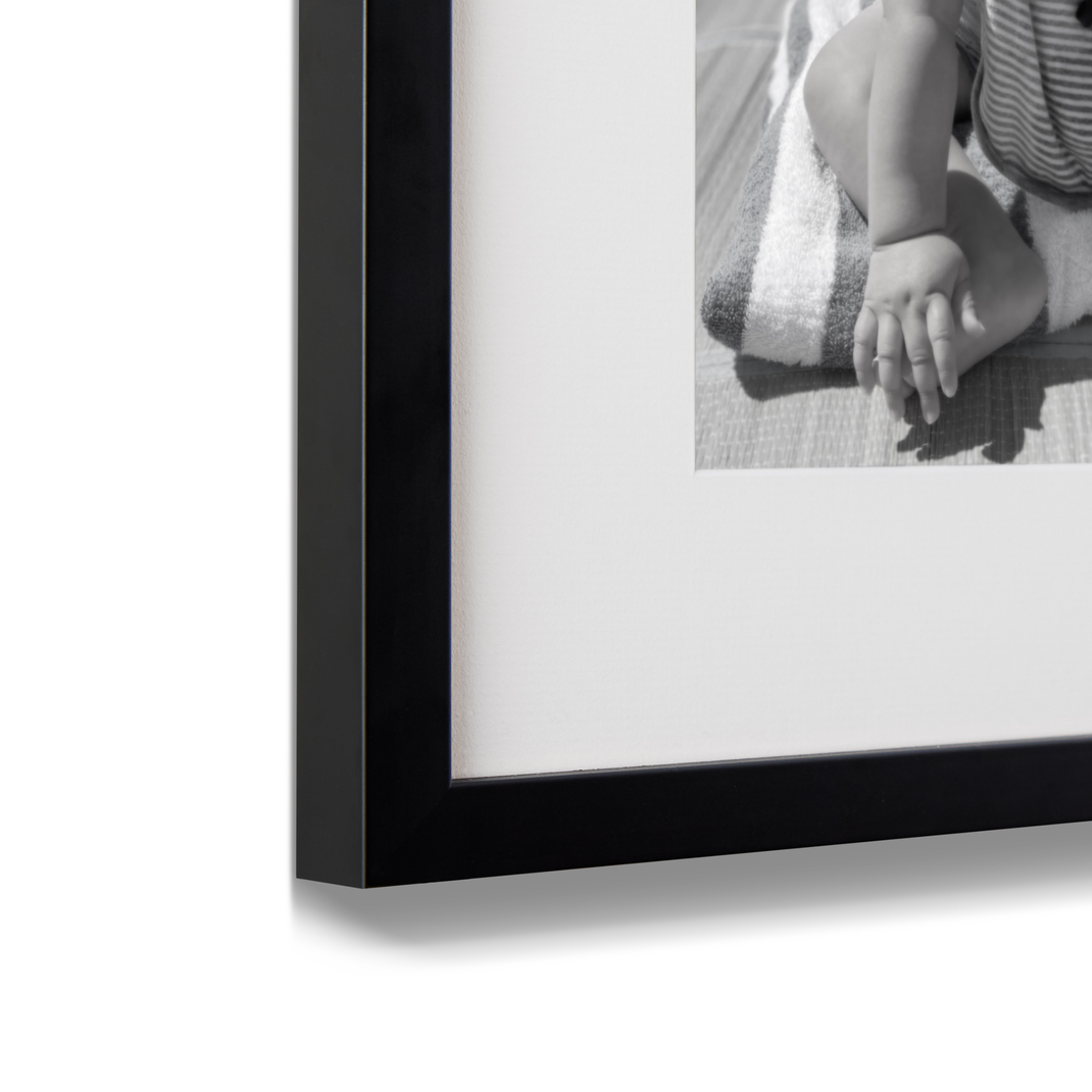 Corner detail shot of 11x11 black gallery wall frame
