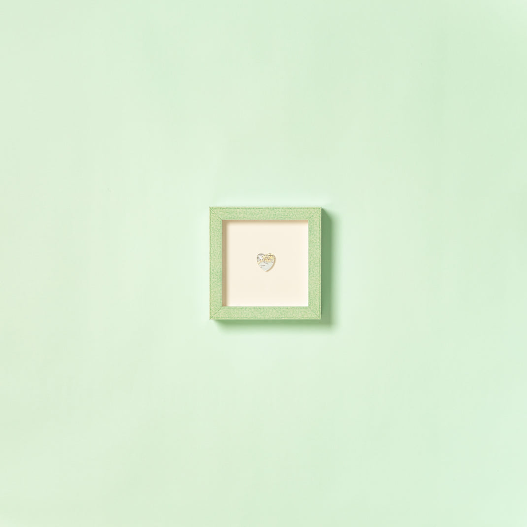 heart-shaped pin framed in mint green glazed Positano frame