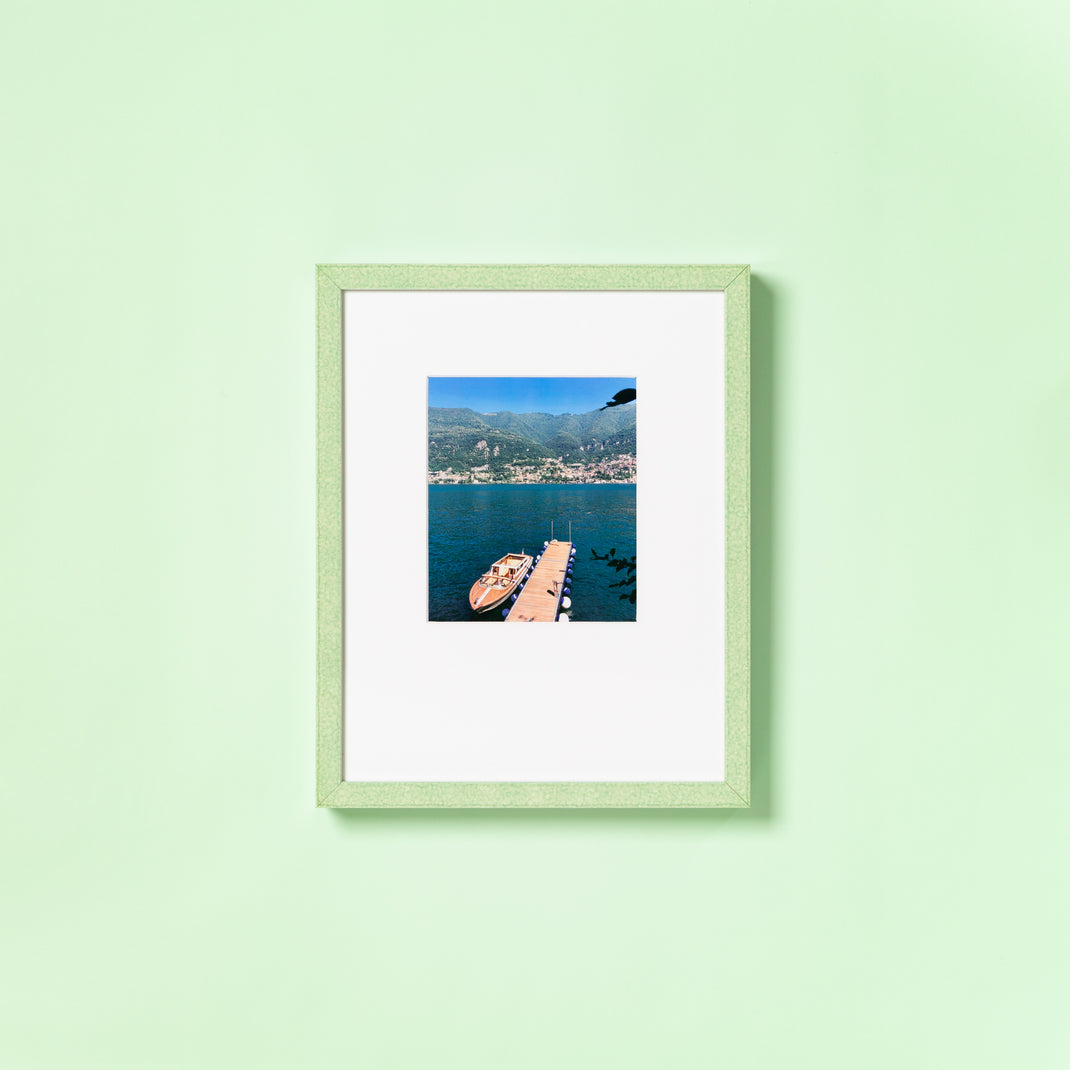 landscape photo of a boat framed in mint green glazed Positano frame