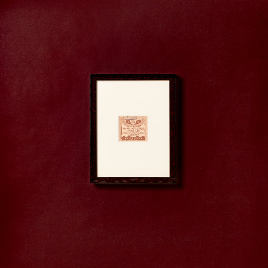 vintage label framed in deep burgundy glazed Rome frame with a white mat