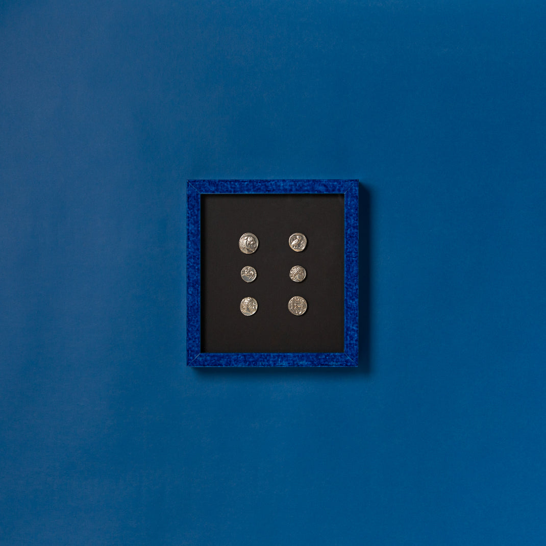 coin collection framed in framed in royal blue glazed Santorini frame with a black mat