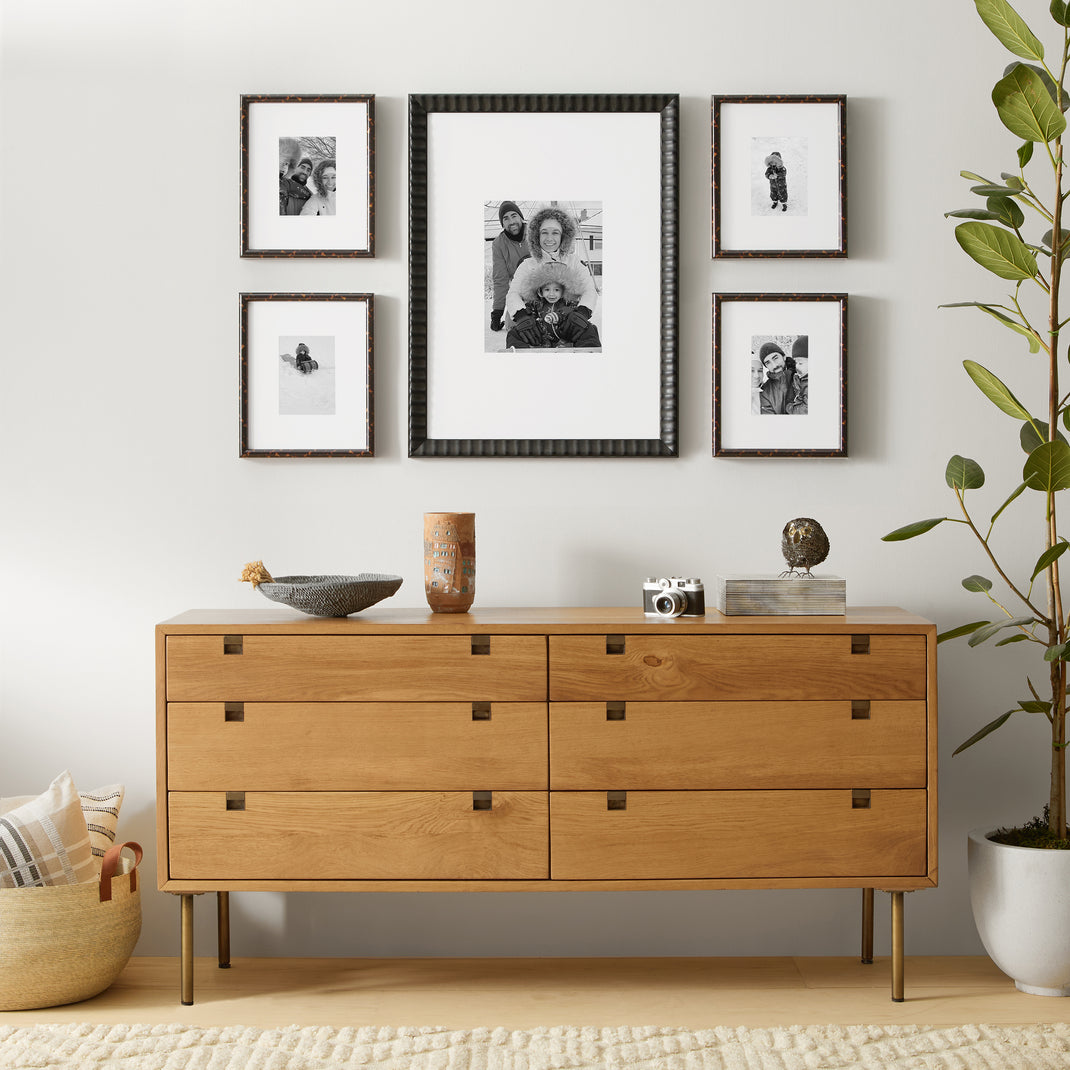 5 frames with black and white family photos