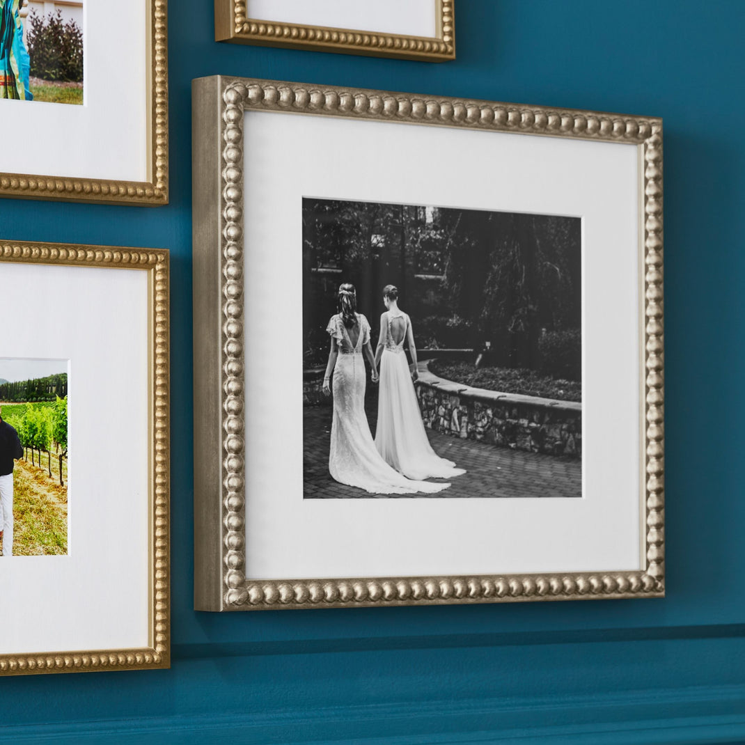 Wedding photo on a wall in a silver frame