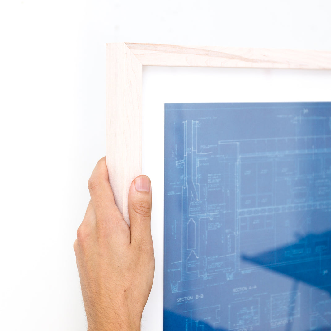 top left corner of architectural blueprint framed in bleached maple gallery frame