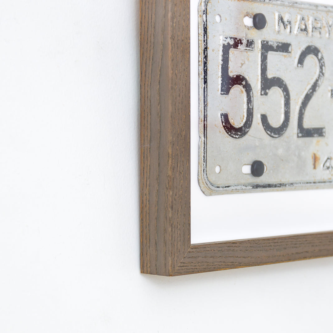 bottom left corner of Maryland license plate framed in Gray Ash gallery frame