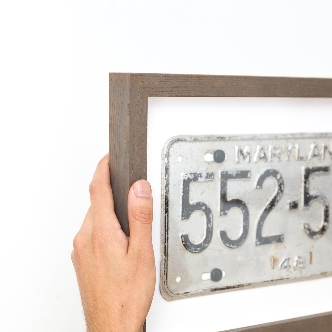 top left corner of Maryland license plate framed in Gray Ash gallery frame