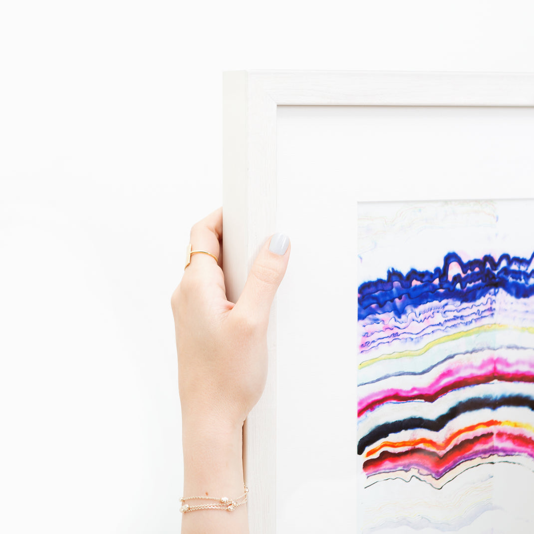 top left corner of colorful abstract line art framed in whitewashed gallery Monterey frame