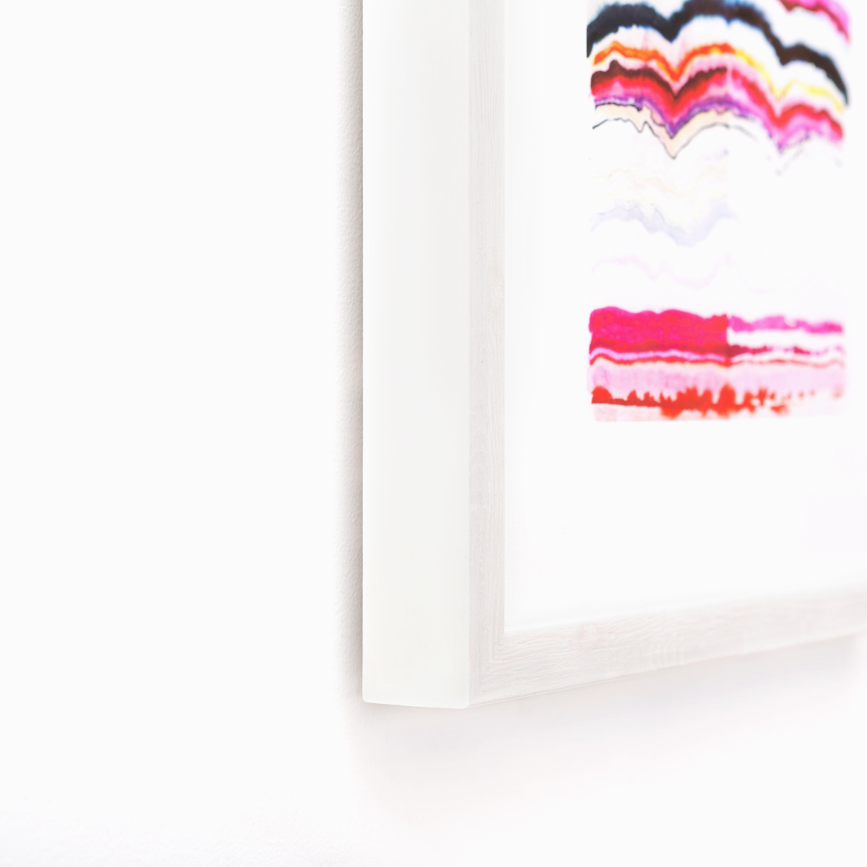 bottom left corner of colorful abstract line art framed in whitewashed gallery Monterey frame
