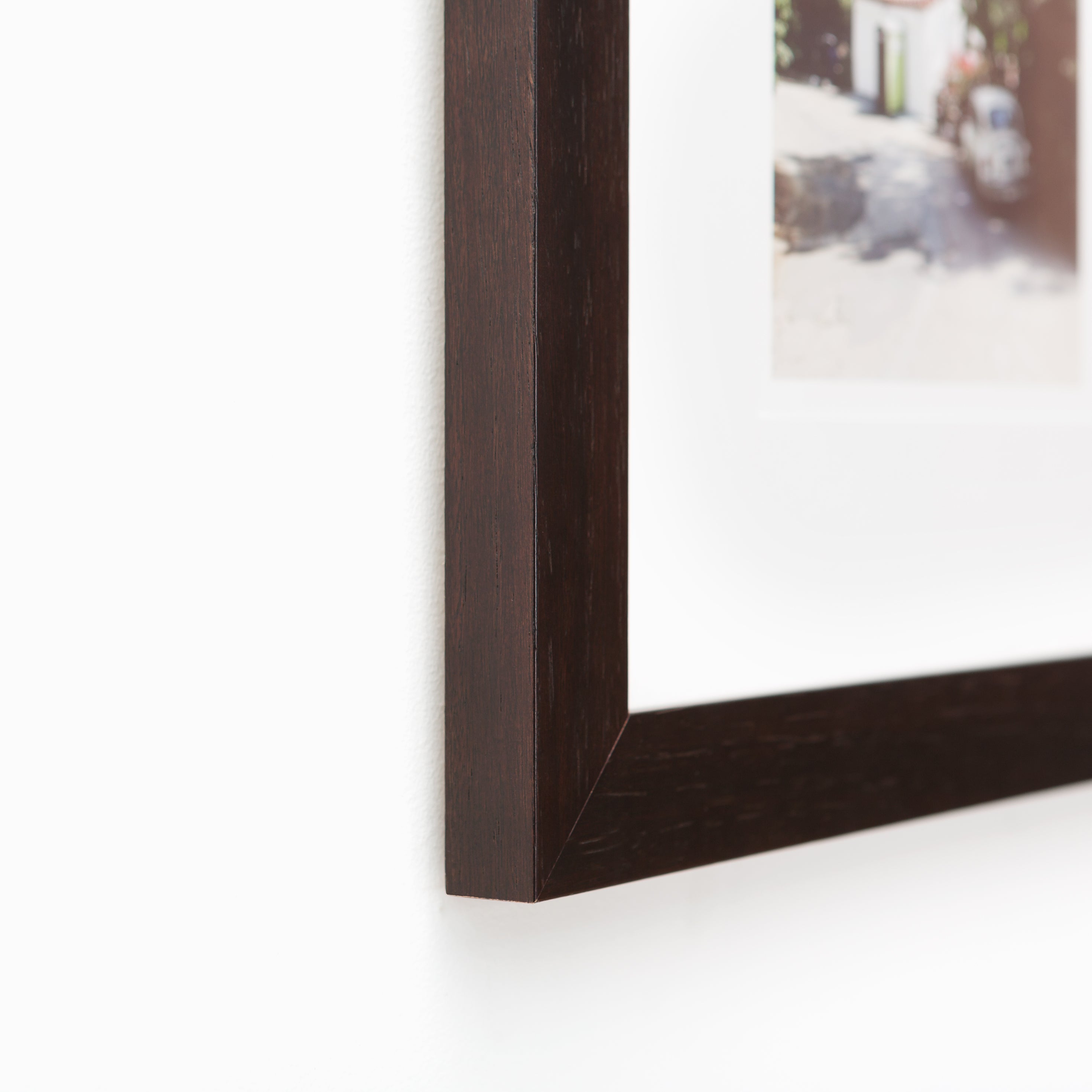 bottom left corner of rural landscape photo framed in espresso wood Tacoma frame