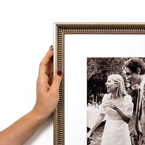 Corner image of Arlington fluted antique silver frame with black & white wedding photo